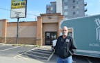 The Landing co-founder Dan Fifield stands in front of the former National Pawn Shop, the proposed site of the homeless shelter’s permanent day cente