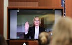 Model Kate Moss is sworn in via video link at the Fairfax County Circuit Courthouse in Fairfax, Virginia, on May 25, 2022. 