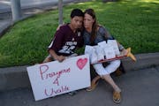 Diego Esquivel and Linda Klaasson comforted each other Wednesday as they honored the victims killed in Tuesday’s shooting at Robb Elementary School 