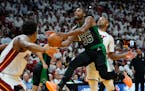Celtics guard Marcus Smart drives to the basket as Heat forward P.J. Tucker defends during the second half of Game 5 