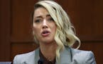 Actor Amber Heard testifies in the courtroom in the Fairfax County Circuit Courthouse in Fairfax, Va., Thursday, May 26, 2022.