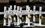 Crosses with the names of Tuesday’s shooting victims outside Robb Elementary School in Uvalde, Texas, on Thursday.