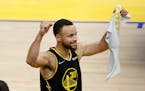 Golden State guard Stephen Curry celebrates after the team’s win over the Mavericks in Game 5 of the NBA Western Conference finals