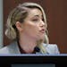 Actor Amber Heard testifies in the courtroom in the Fairfax County Circuit Courthouse in Fairfax, Va., Thursday, May 26, 2022. 