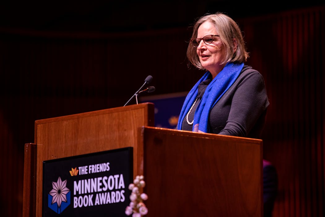 Fiona McCrae accepts the Kay Sexton lifetime achievement award at the Minnesota Book Awards ceremony in April 2022.