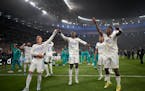 Real Madrid players celebrated their 1-0 Champions League final victory over Liverpool on Saturday in Paris. 