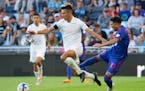 New York City midfielder Alfredo Morales (7) steals the ball from Minnesota United midfielder Emanuel Reynoso (10) in the first half Saturday, May 28,