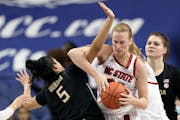 Elissa Cunane of NC State fought past a Florida State defender during a March ACC Tournament game.