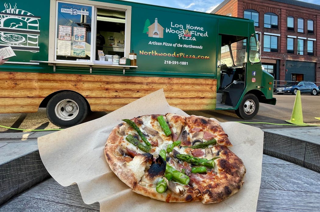 Asparagus and prosciutto pizza outside a brewery in Duluth’s Lincoln Park neighborhood.
