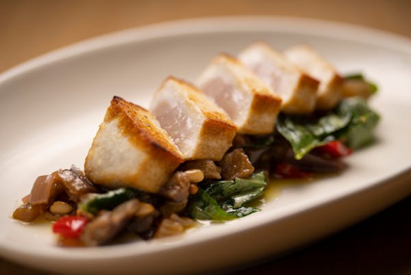 Swordfish, with eggplant caponata and pine nuts, as prepared by chef Denny Leaf-Smith at All Saints in Minneapolis Tuesday, May 31, 2022.    ]   JEFF 