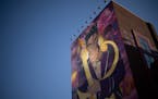 A giant mural of Minneapolis music icon Prince, the result of the Crown Our Prince Mural Project painted by Hiero Veiga on the exterior wall of parkin