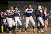 Chanhassen players celebrate as Kenna Berman (2) hit an RBI in the bottom of the seventh inning to win the Class 4A championship game against Shakopee