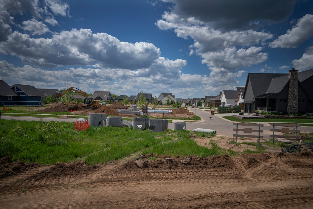 Construction continued at the Wildflower at Lake Elmo development, where heavy equipment moved and shaped dirt for new lots in Lake Elmo on Thursday.