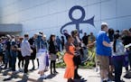 Crowds lined up for their tour of Paisley Palace after partaking in some outdoor activities for annual Prince Celebration at Paisley Park on Friday in