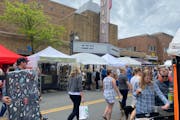 Visitors browsed the 55th annual Edina Art Fair on Sunday with more than 300 vendor booths back at the 50th and France commercial district after a two