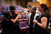 From left, choir and orchestra students Nevaeh Embaye, Cam Toal, Toshio Miller and Kenzie Finne converse during intermission at South High’s spring 
