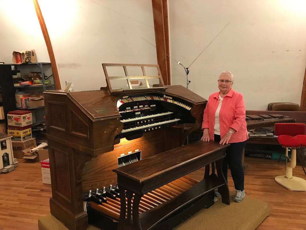 Marilyn Matson at the console of a Wurlitzer theater pipe organ installed in the hayloft of a barn converted into a home in Spring Valley, Minn.