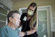 Terry Johnson had his vitals checked by nurse Cassie Jennison during their final weekly checkup at his home in Chaska on June 3. Johnson had a hip rep