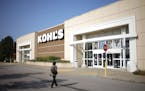 An employee walks towards the front entrance of a Kohl’s Corp. department store in Lexington, Ky., on Aug. 11, 2021.