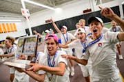 Orono team captain Matias Maule hefted the hardware as he and his teammates celebrated after defeating Edina in the Class 2A team tennis final.