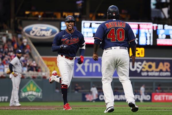Byron Buxton smiled on his way to home plate after hitting his second home run of the night against the Tampa Bay Rays.
