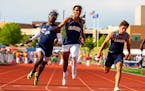 Richlu Tudee, left, of Champlin Park finishes first in the 100m dash during the Minnesota Class 3A track and field state finals.