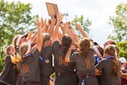 Forest Lake High School Rangers celebrate after winning the 2022 State Class AAAA championship game at Caswell Park in North Mankato, Minnesota Friday