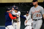 Minnesota Twins third baseman Gio Urshela, center, is congratulated by teammates for a game-winning RBI on May 23 vs. Detroit.