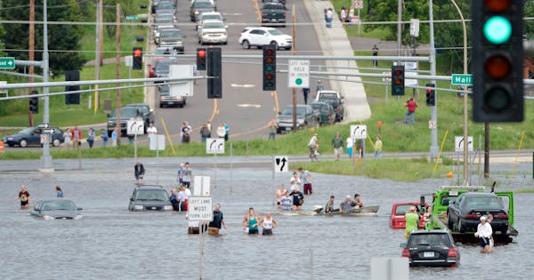 Floodwaters covered roads near the Miller Hill Mall in Duluth on June 20, 2012.