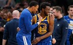 Golden State Warriors forward Andrew Wiggins (22) celebrates with forward Otto Porter Jr. (32) as time winds down in Game 6.