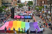 The Rainbow flag, Bi flag, Trans flag and Leather flag at the start of the Pride parade down Hennepin Ave, Minneapolis.     ] GLEN STUBBE ¥ glen.stub