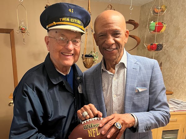 Dick Jonckowski, in his Sims Security cap and jacket from 1975, and Drew Pearson were photographed during a recent meeting at Jonckowski’s home in S