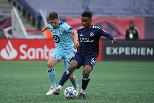 Minnesota United captain Wil Trapp (20) went against New England’s Wilfrid Kaptoum (5) during Sunday’s game in Foxborough, Mass.