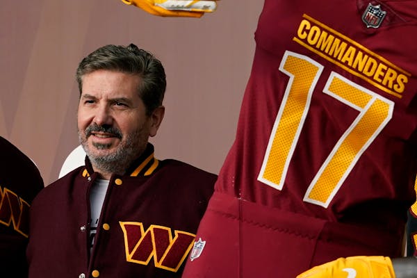 Dan Snyder, co-owner and co-CEO of the Washington Commanders, poses for photos during an event to unveil the NFL football team’s new identity, Wedne