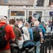 Travelers queue up at a security checkpoint in Denver International Airport in May. Airlines canceled more than 1,000 flights by midmorning June 17 as