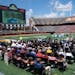 Audience members listen to speakers during a celebration of life honoring Marion Barber III, the former Gophers running back who died June 1, Wednesda
