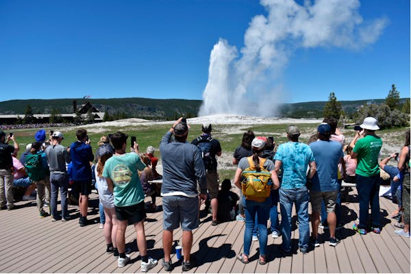 Tourists return to see Yellowstone's Old Faithful