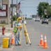 A MNDOT Survey worked along Arcade Street, in St. Paul on Wednesday, June 22, 2022. The Minnesota Department of Transportation is planning to redesign