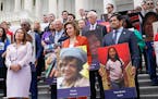Rep. Veronica Escobar, D-Texas, House Speaker Nancy Pelosi of Calif., and Rep. Jimmy Gomez, D-Calif., attendrf an event on the steps of the U.S. Capit
