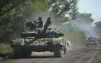 Ukrainian troops moved by tanks in the eastern Ukrainian region of Donbas on June 21, 2022.