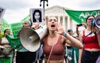 Abortion-rights activists protest outside the Supreme Court in Washington on Friday, the day the Supreme Court overruled Roe v. Wade, eliminating the 