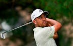 Xander Schauffele watches his shot on the eighth hole during the second round of the Travelers Championship