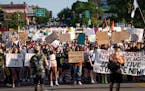 A crowd marched on Cedar Avenue to downtown Minneapolis  during a University of Minnesota student-led protest Friday after the Supreme Court ruling. 