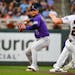 Rockies shortstop Jose Iglesias throws to first after forcing out the Twins’ Max Kepler during the fourth inning