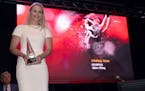 In a photo provided by the U.S. Olympic & Paralympic Committee, Lindsey Vonn displays her award during the U.S. Olympic and Paralympic Hall of Fame in