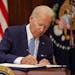 President Joe Biden signs the Bipartisan Safer Communities Act into law in the Roosevelt Room of the White House on Saturday, June 25, 2022, in Washin