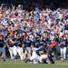 Mississippi players dogpiled following their 4-2 victory over Oklahoma to win Game 2 of the NCAA College World Series finals on Sunday in Omaha, givin
