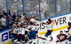 The Colorado Avalanche celebrate after the team defeated the Tampa Bay Lightning in Game 6 of the NHL hockey Stanley Cup Finals.