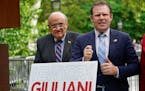 FILE - Andrew Giuliani, right, a Republican candidate for Governor of New York, is joined by his father, former New York City mayor Rudy Giuliani, dur