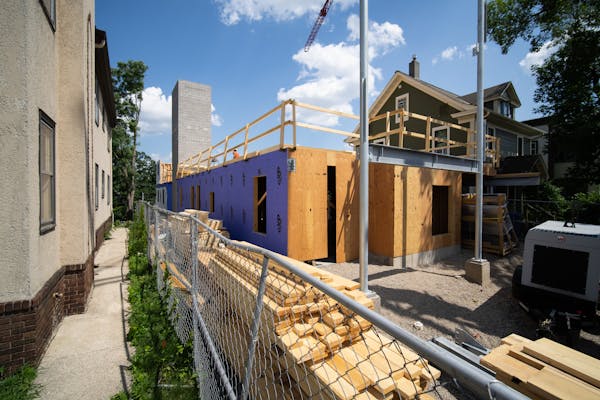 Construction on a small apartment building in Uptown Minneapolis on Monday, June 27. The site at 3333 Hennepin Avenue was designed in response to Minn